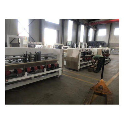 Machine à coller pour la fabrication de matériaux d'emballage en bois et de boissons